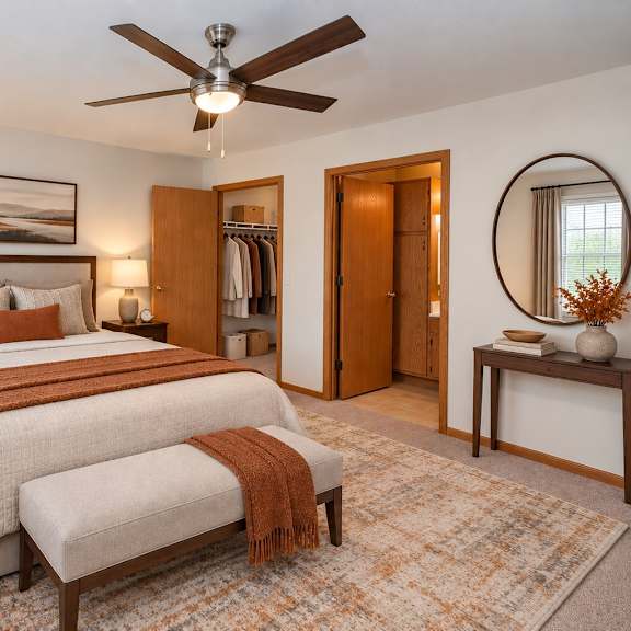 a bedroom with two beds and a ceiling fan.
