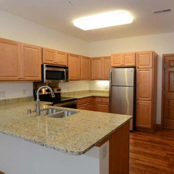 new countertops and cabinets at highlands at riverwalk apartments 55+, mequon, wisconsin 53092