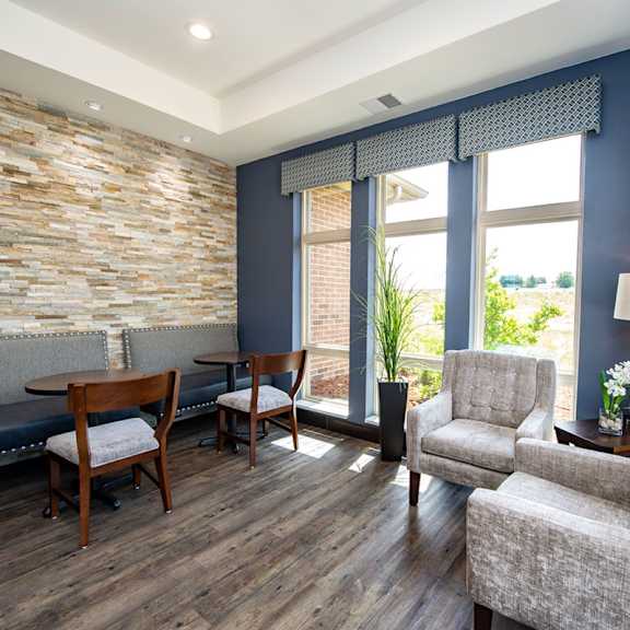 a living room with couches and chairs and a table