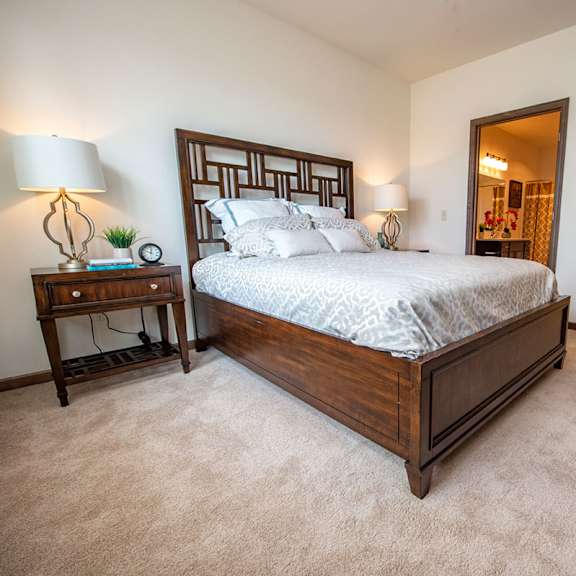 a bedroom with a bed and a closet