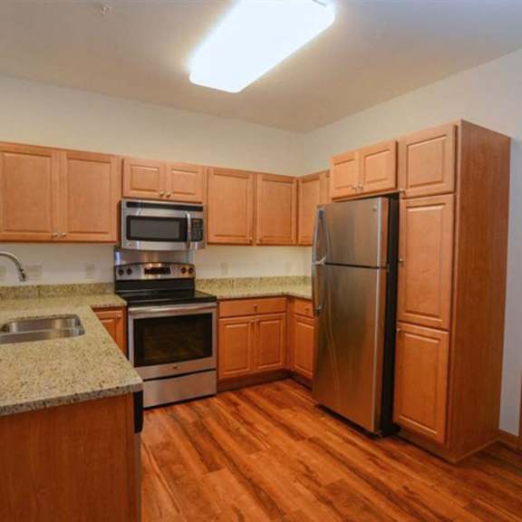 gourmet kitchens with dishwasher and disposal at highlands at riverwalk apartments 55+, mequon, wi,53092