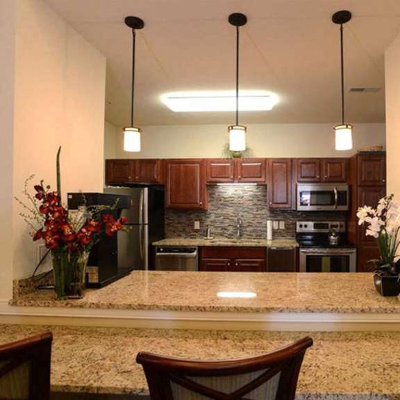 modern community room kitchen at highlands at riverwalk apartments 55+, wisconsin 53092