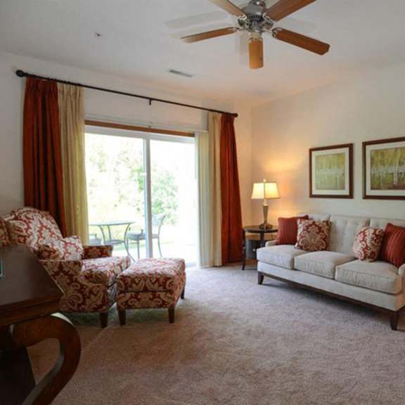 carpeted living rooms with attached balconies and patios at highlands at riverwalk apartments 55+, 10954 n cedarburg road