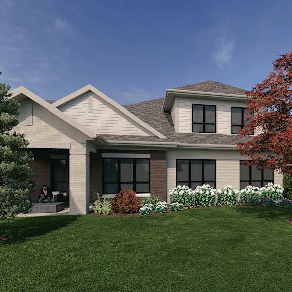 a house with a grey roof and a tree with red leaves in front of it.