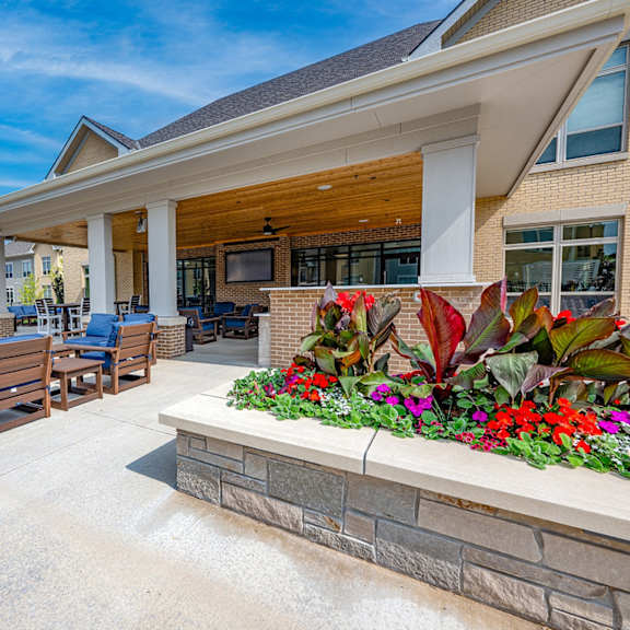 the reserve at city center spacious covered patio with chairs and flowers