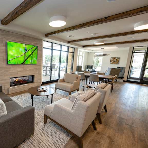 a living room with couches and chairs and a fireplace