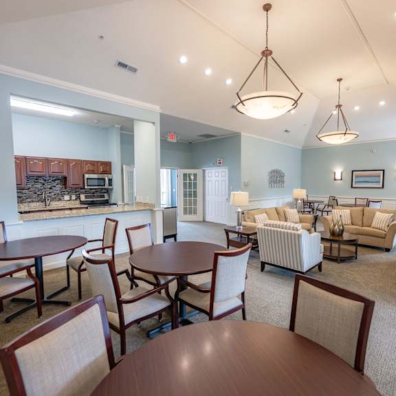 a living room with a dining table and chairs.