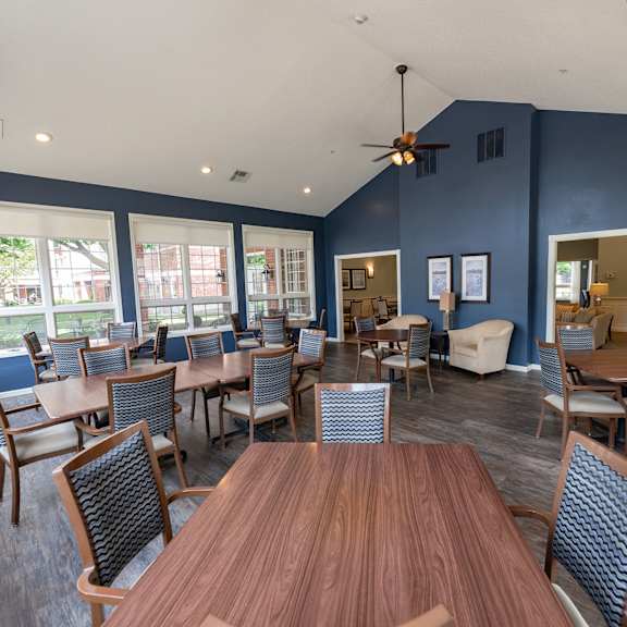 a room with a wooden table and chairs.