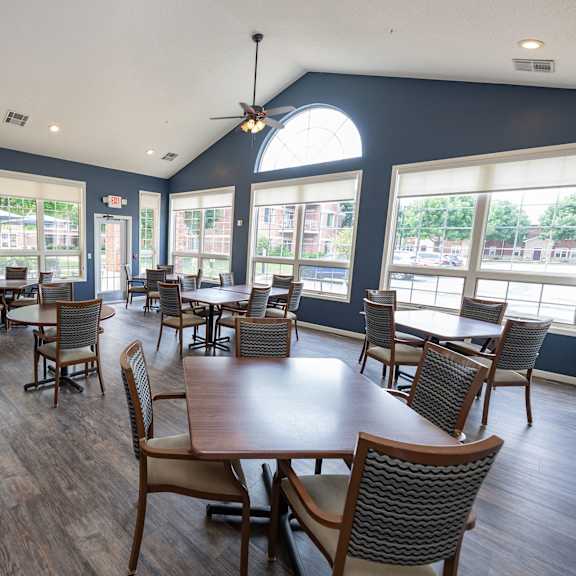 a large room with a table and chairs.