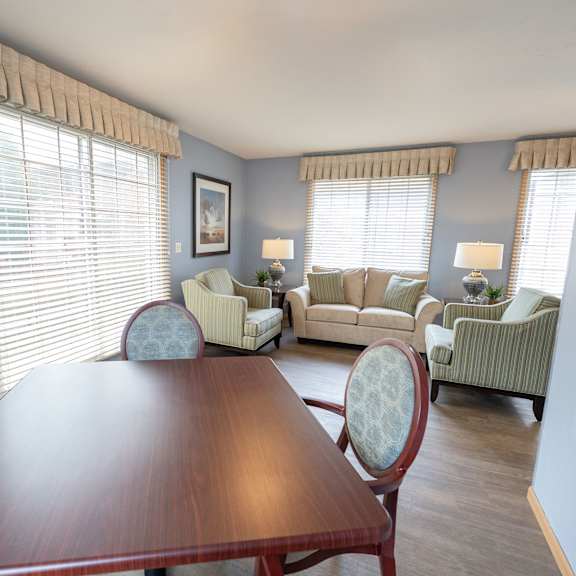 a dining room with a wooden table and chairs.