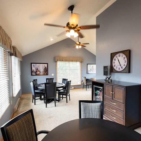 a dining room with a table and chairs.