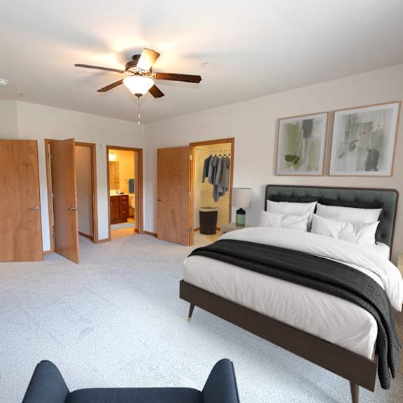 a large bedroom with a bed and a ceiling fan