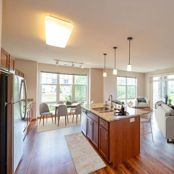 a view of a living room and dining room from the kitchen of a house