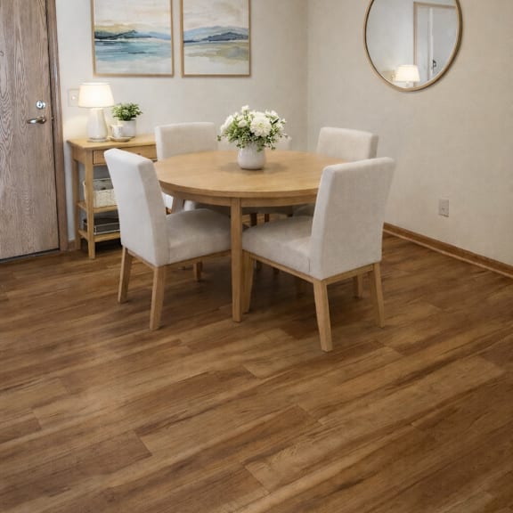 a dining room with a wooden table and chairs.