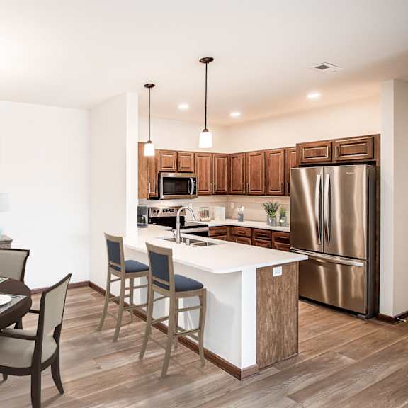 a kitchen and dining area in a 555 waverly unit