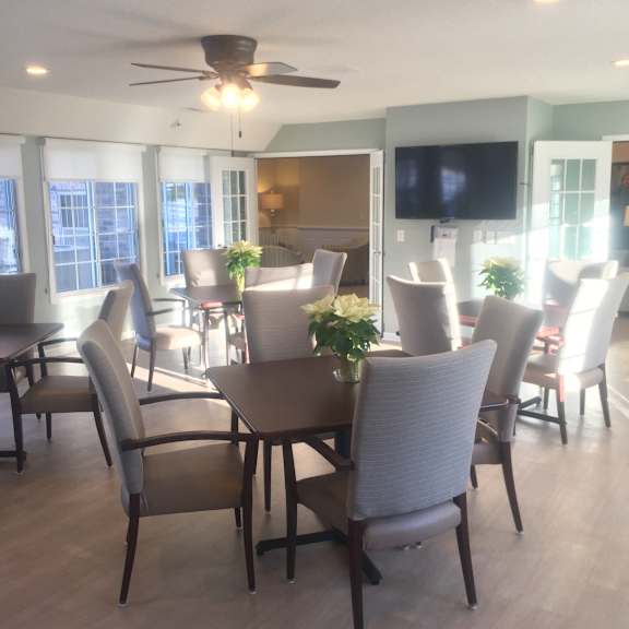 community room with pleanty of seatiing area for resident events at wildwood highlands apartments & townhomes 55+, wi,53051