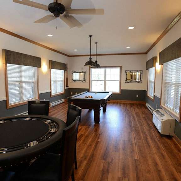 multi-purpose room with billiards table at highlands at riverwalk apartments 55+, mequon, wisconsin