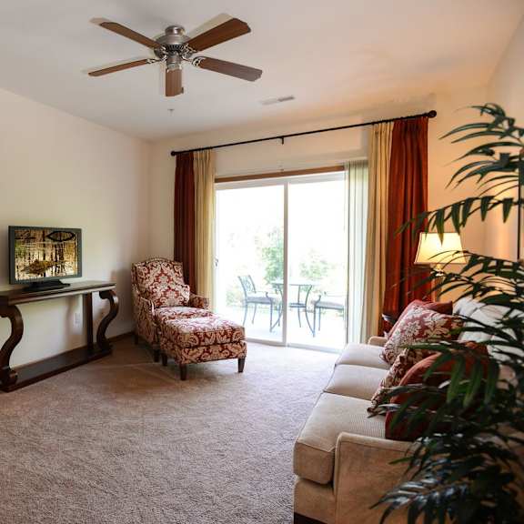 large living rooms with oversized windows at highlands at riverwalk apartments 55+, wisconsin 53092