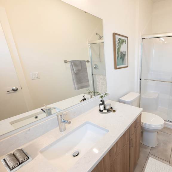 a bathroom with a sink toilet and shower