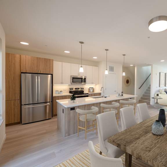 a kitchen and dining room with a table and chairs