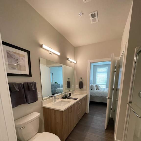 a small bathroom with a toilet sink and shower