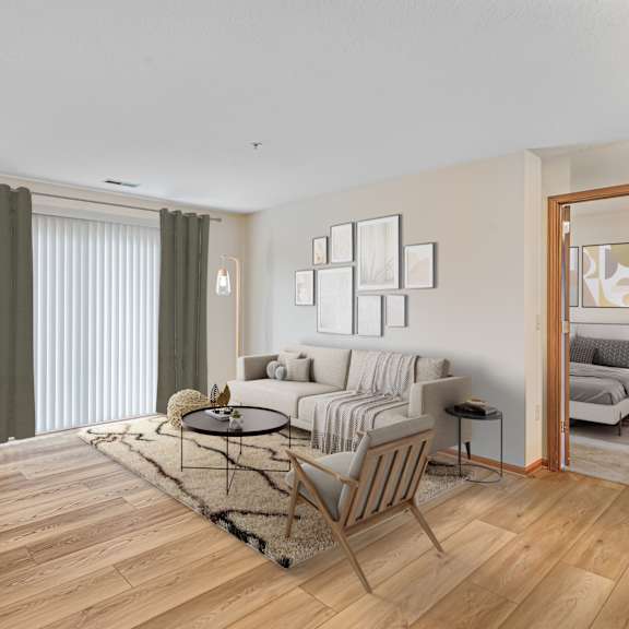a living room with a brown chair and a black speaker.