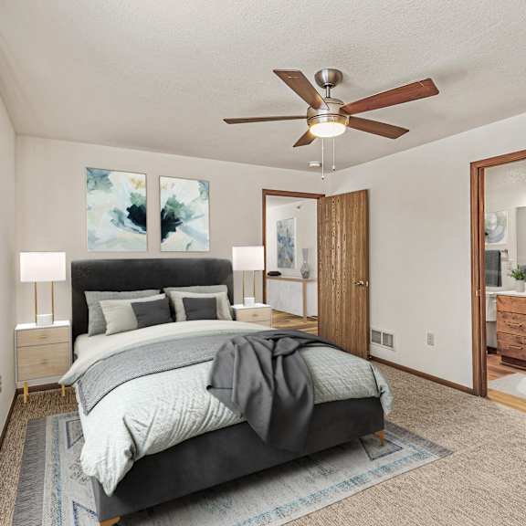 a bedroom with a bed, dresser, and mirror.