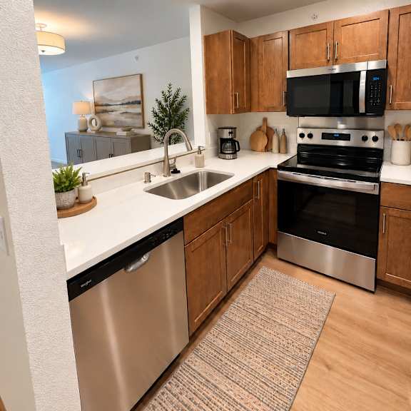 a kitchen with a stainless steel dishwasher and oven.