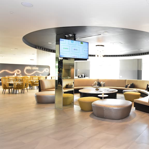 modern lobby lounge with curved seating areas at 360 luxury apartments, california, 92122