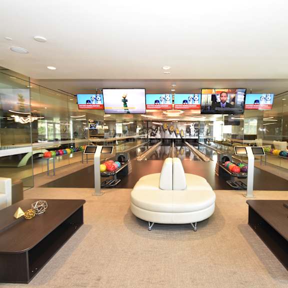 private bowling lanes with lounge seating at 360 luxury apartments, san diego
