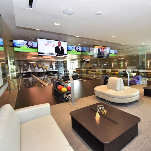 private bowling lounge with seating and television screens at 360 luxury apartments, california, 92122