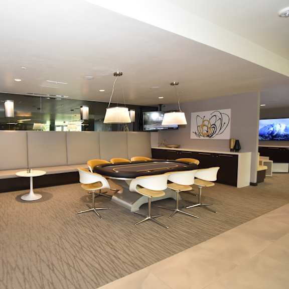 suite with banquette seating and gaming table at 360 luxury apartments, san diego, ca
