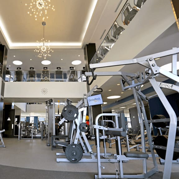 gym with a variety of equipment at casa mira view apartments, san diego