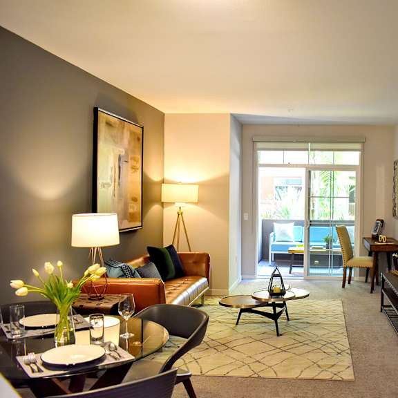 well-lit living room at casa mira view apartments, san diego, 92126