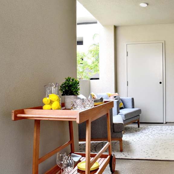 a table with lemons and glasses on it at casa mira view apartments, san diego, 92126