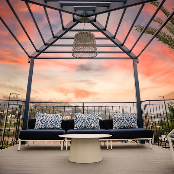 patio with a couch at casa mira view apartments, california, 92126