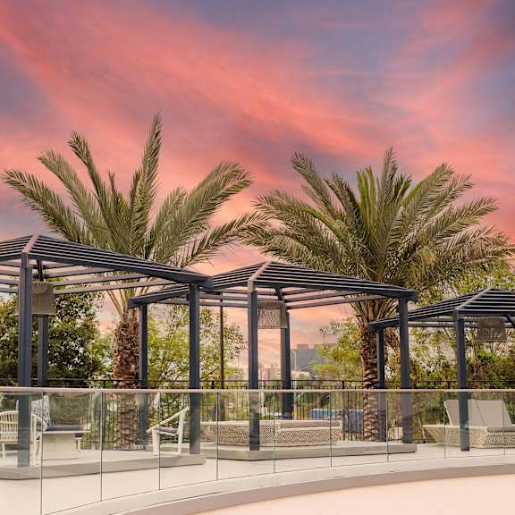 patio with a glass railing at casa mira view apartments, san diego