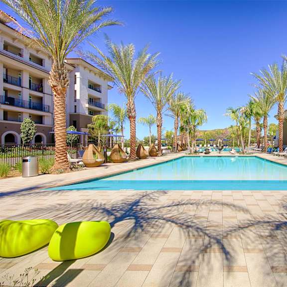 pool with lounge chairs at casa mira view apartments, california, 92126