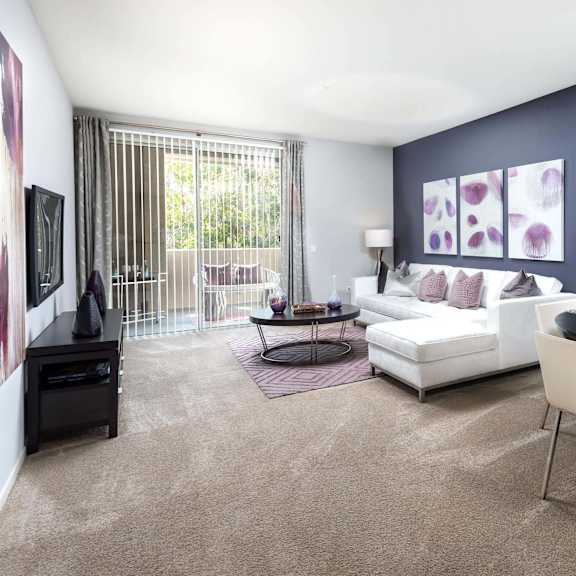 a modern living room with a dining table and chairs. at la jolla crossroads apartments, california
