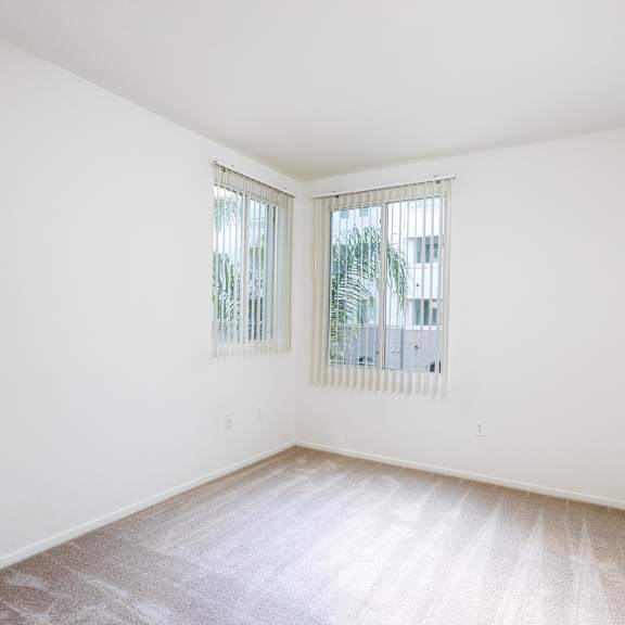 a room with a window and a carpet on the floor. at la jolla crossroads apartments, california, 92122