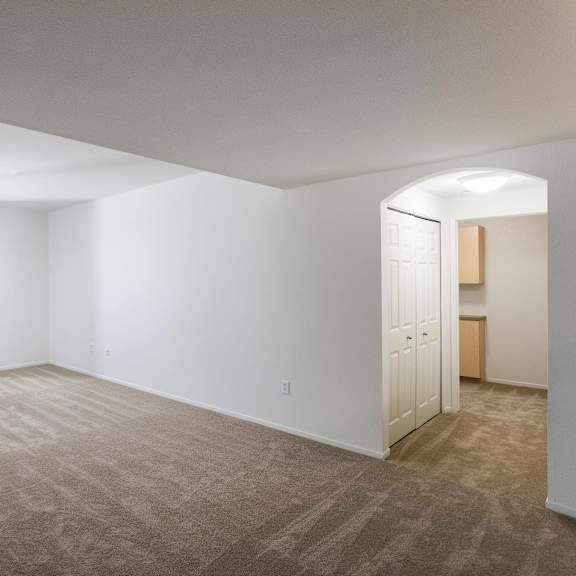 a room with a carpeted floor and a doorway leading to another room. at la jolla crossroads apartments, california, 92122