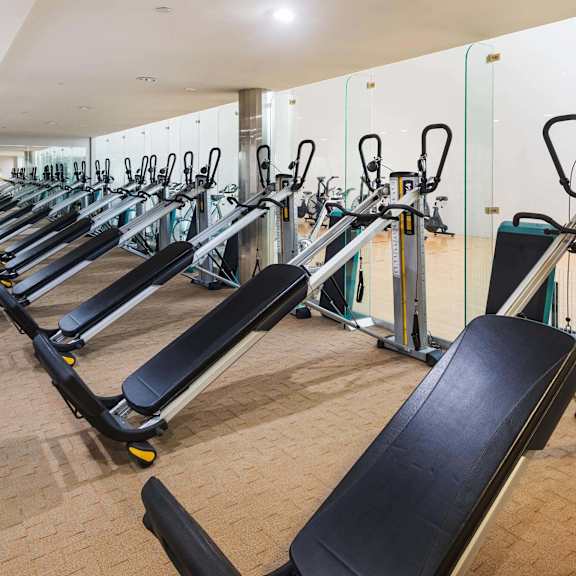 a gym with treadmills and elliptical machines. at la jolla crossroads apartments, san diego, 92122