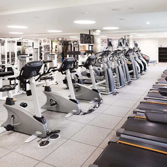 a gym with treadmills and elliptical machines. at la jolla crossroads apartments, san diego, 92122
