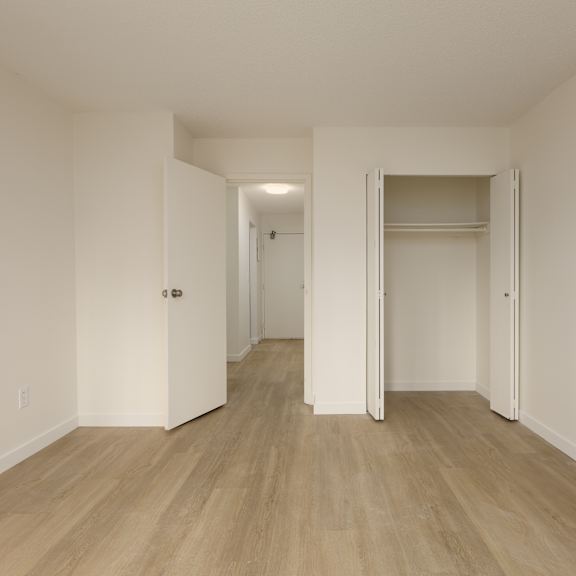 a room with a white door and a white wall.