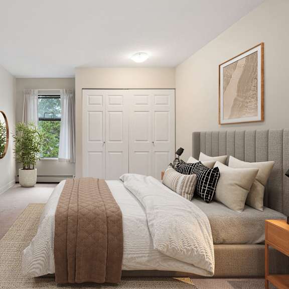 a bedroom with a large bed and a television on a wooden stand.