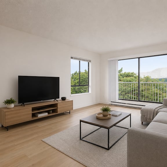 a living room with a grey couch, a wooden cabinet, a flat screen tv and a glass coffee table.