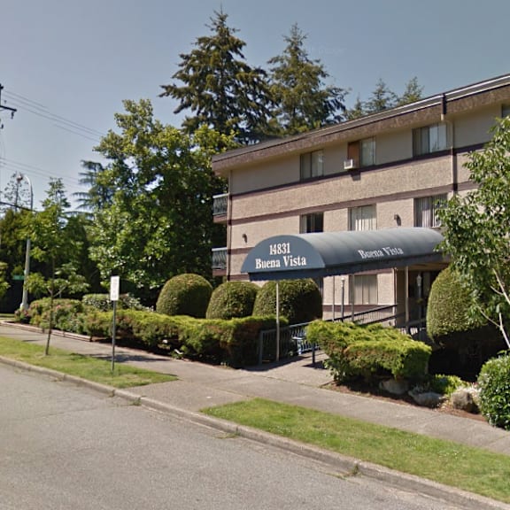 a street view of a building with the sign "buena vista" on it.