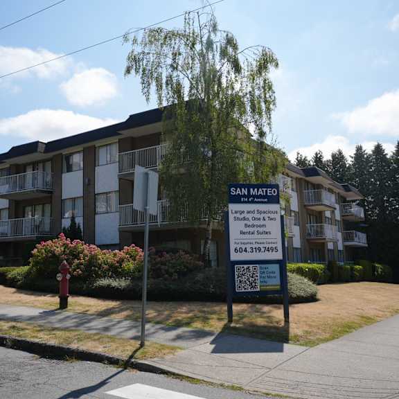 apartment complex named san mateo with a sign in front.