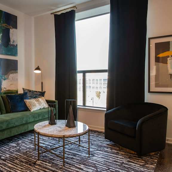 Thumbnail 4 of 8 Living Room with deep green accents at The Apex at CityPlace, Overland Park, KS, 66210