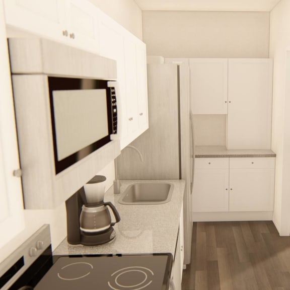 Thumbnail 7 of 12 a kitchen with a stove top oven next to a microwave t Brownstones at Palisade Park Townhomes, Broomfield